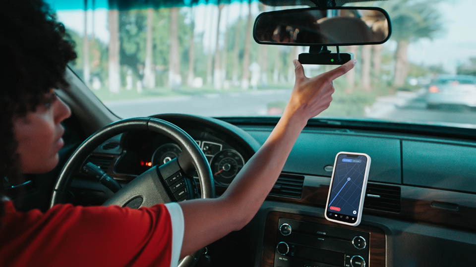 Woman in car with Hivemapper
